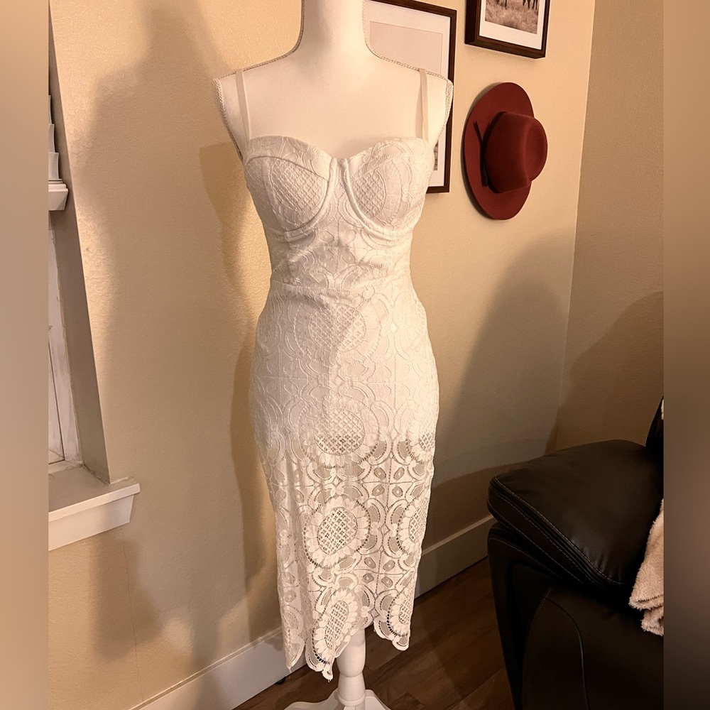 White Crochet Bebe dress with built in shorts. Size 8. Dry cleaned.